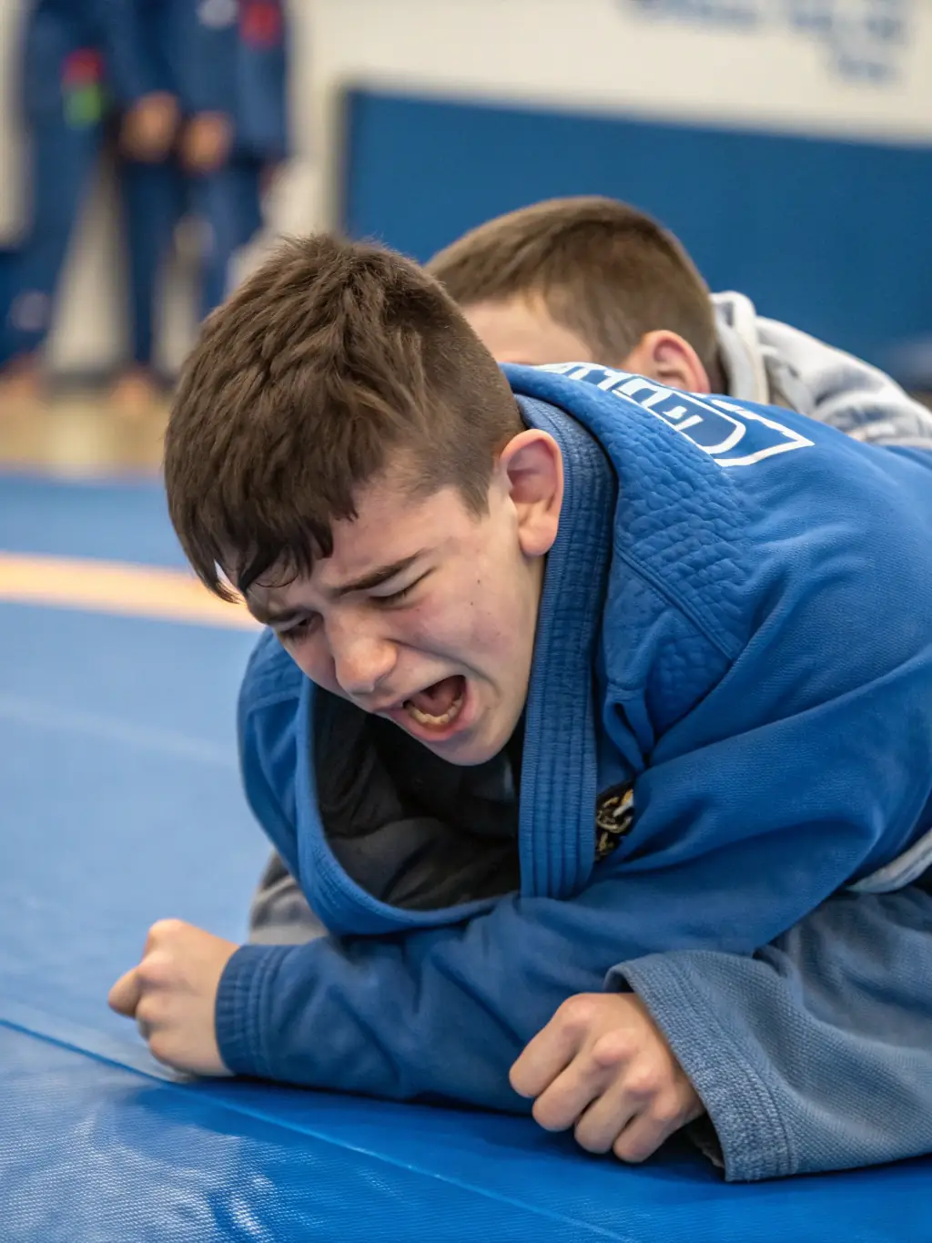 A focused image of wrestlers practicing Sambo techniques, highlighting grappling and submission holds, in a training session with experienced instructors.
